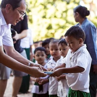 a boy receiving books